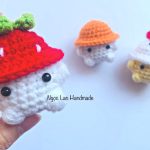 Little animal wearing a strawberry hat