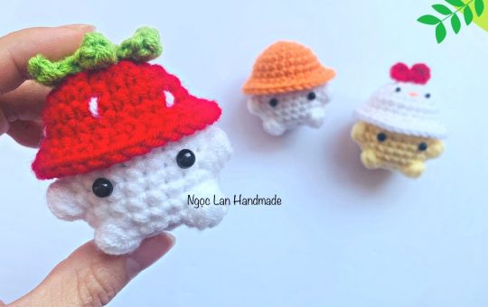 Little animal wearing a strawberry hat