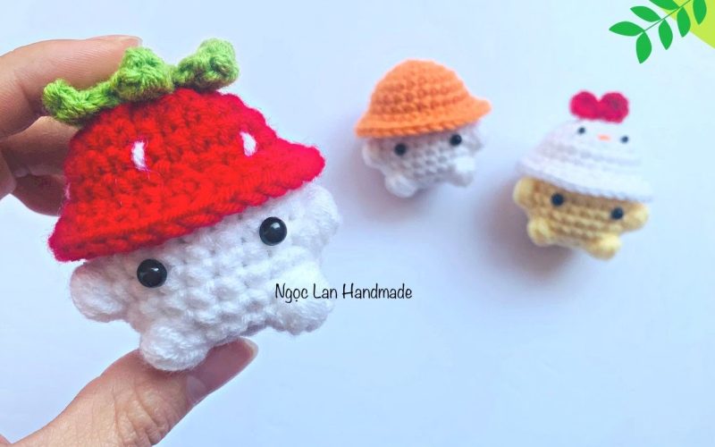 Little animal wearing a strawberry hat